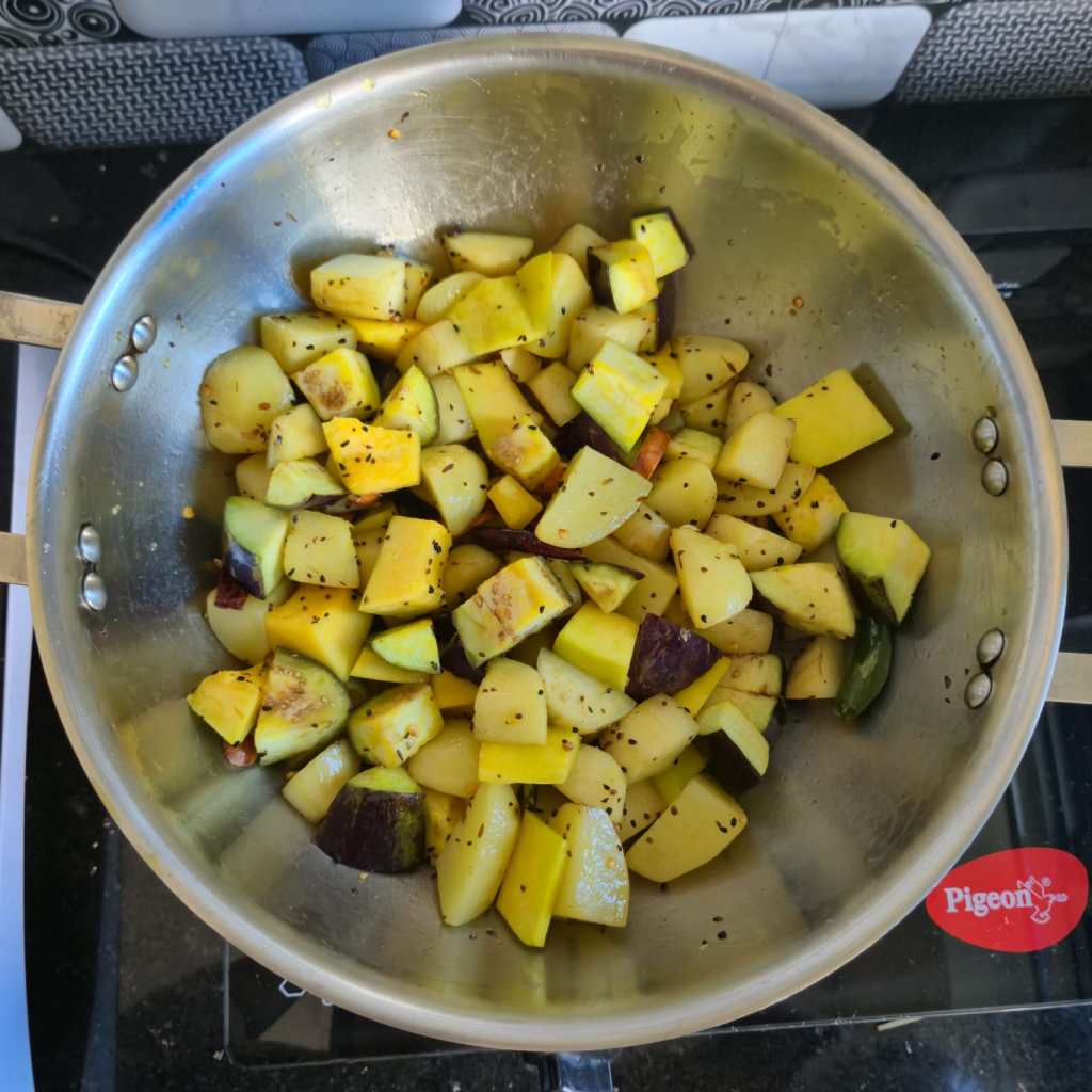 Frying all the veggies for Kumro Shaak er Chochchori