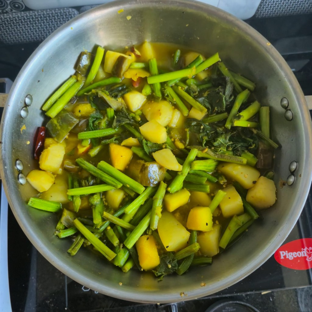 Adding water to the veggie mixture