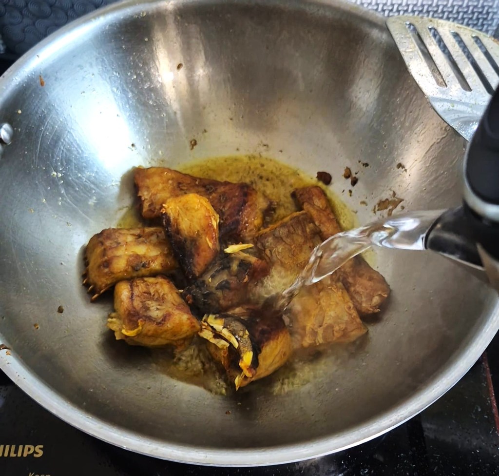Cooking fish in a pan